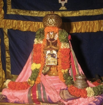 Offering curd rice in an earthen pot to the elumalaiyan